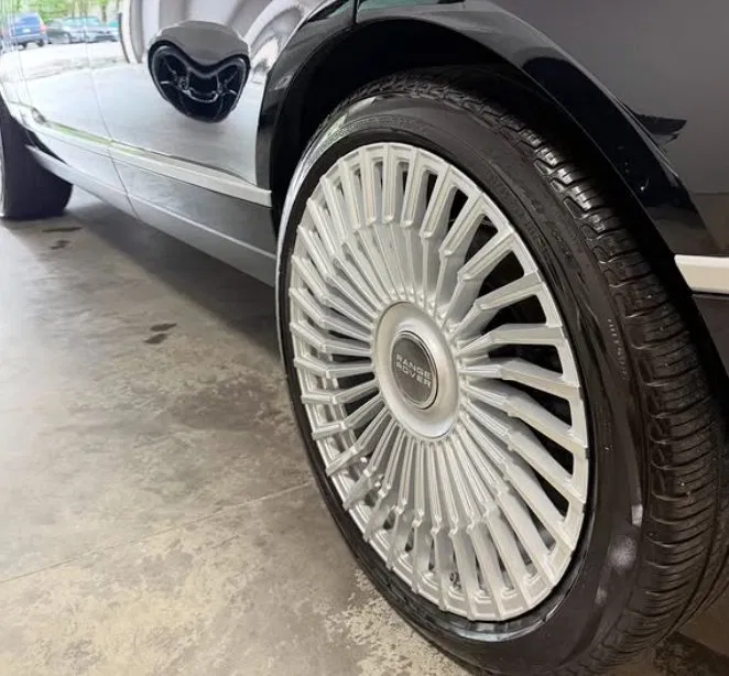 Range Rover wheel and lower panel close-up after detail