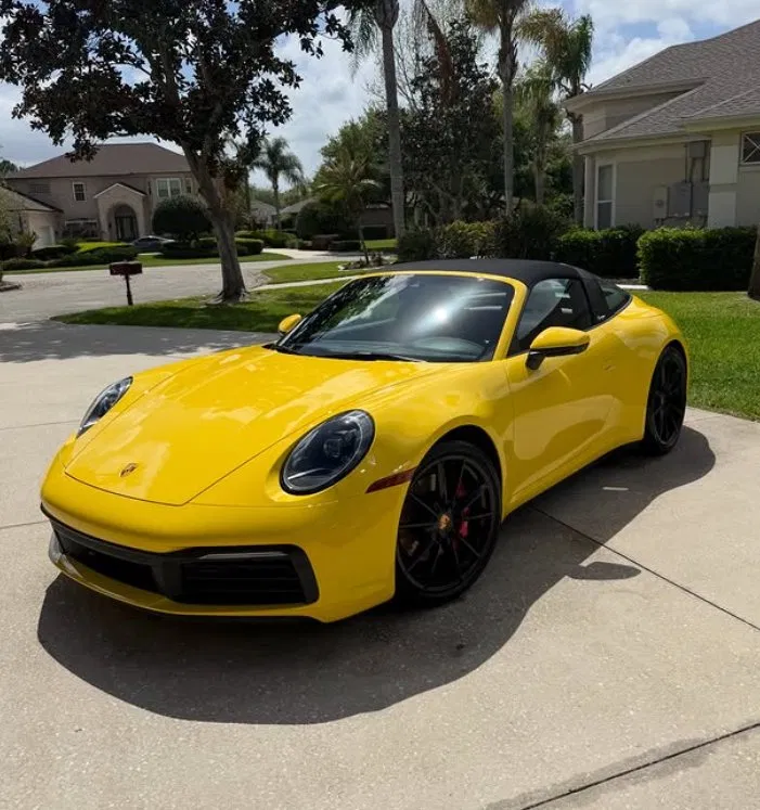 Yellow Porsche 911 Targa detailed in a Central Florida driveway