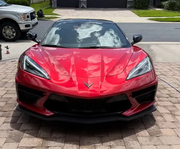 Front of red Corvette C8 polished and detailed