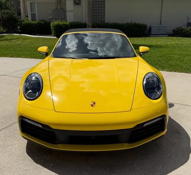 Front view of yellow Porsche 911 after full detail